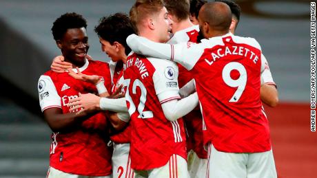 Arsenal&#39;s Bukayo Saka (far left) celebrates with his teammates after scoring his side&#39;s third goal at the Emirates Stadium against Chelsea.