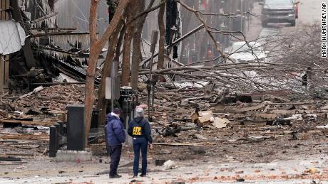 Emergency personnel work near the scene of the Nashville explosion Friday.