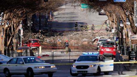 Investigators examine the site of the explosion in downtown Nashville, Tennessee, on Sunday, December 27. 