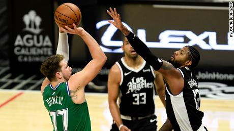 Luka Doncic, left, led Dallas in every main statistic with 24 points, eight assists and nine rebounds.