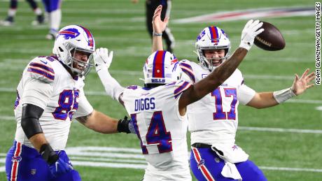 Lee Smith (left) and Allen celebrate with Diggs (middle). 