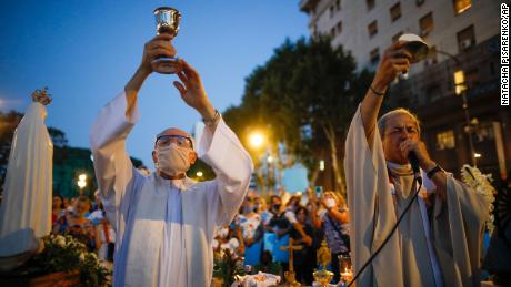 Catholic priests hold a mass during an anti-abortion protest as lawmakers debated its legalization, outside Congress in Buenos Aires on Tuesday.