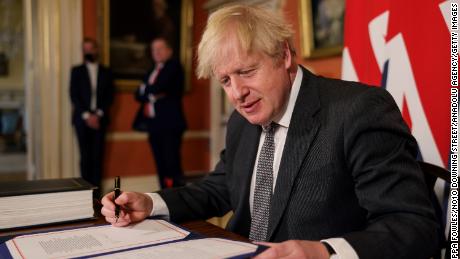 UK Prime Minister Boris Johnson signs the Brexit trade deal with the EU on December 30.