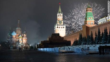 This combo image shows at top fireworks exploding over the Kremlin and the Spasskaya Tower with St. Basil&#39;s Cathedral at left in an almost empty Red Square during New Year&#39;s celebrations in Moscow, Russia, Thursday, Dec. 31, 2020 and below, a file photo taken from the same angle during New Year&#39;s celebrations on Dec. 31, 2019. As the world says goodbye to 2020, there will be countdowns and live performances, but no massed jubilant crowds in traditional gathering spots like the Champs Elysees in Paris and New York City&#39;s Times Square this New Year&#39;s Eve. The virus that ruined 2020 has led to cancelations of most fireworks displays and public events in favor of made-for-TV-only moments in party spots like London and Rio de Janeiro. (AP Photo/Pavel Golovkin, Denis Tyrin)