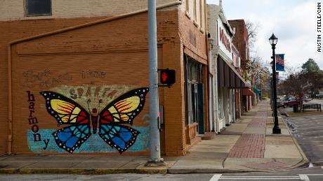 A mural declares, &quot;This is Sparta,&quot; on a building downtown, where many storefronts sit empty. 