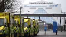 Ambulances are parked outside the NHS Nightingale hospital at the ExCel centre in east London on January 1, 2021.