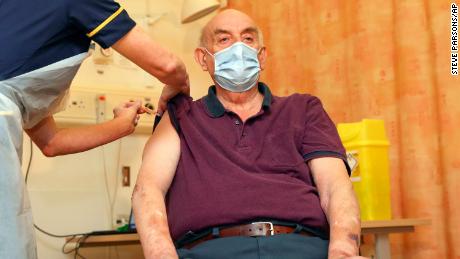 82-year-old Brian Pinker receives the Oxford/AstraZeneca vaccine a hospital in Oxford on Monday.  