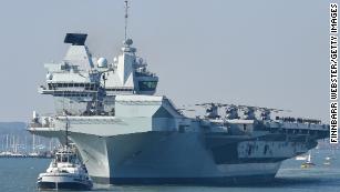 UK says its aircraft carrier strike group is ready to deploy. China&#39;s already watching