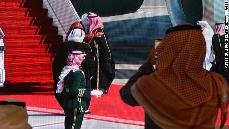 Saudi Crown Prince Mohammed bin Salman welcomes the Emir of Qatar Tamim bin Hamad Al-Thani on a screen in the media centre ahead of the 41st Gulf Cooperation Council (GCC) summit in al-Ula, Saudi Arabia.