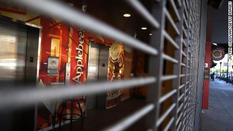 A security gate blocks the entrance to a closed Applebee&#39;s restaurant on August 13, 2020 in San Francisco, California. 