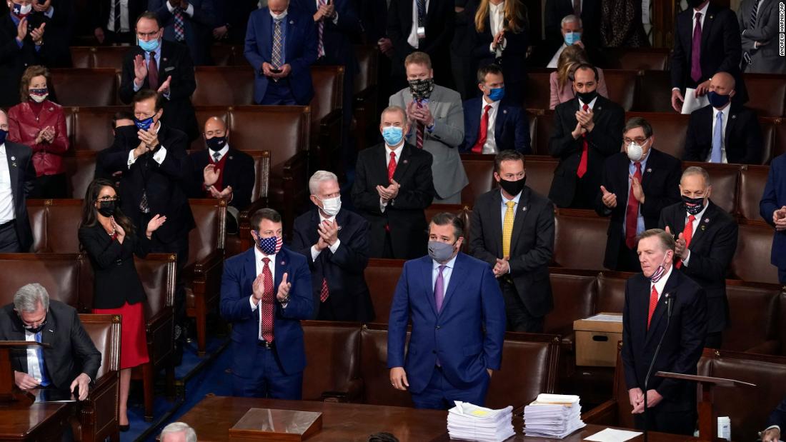 Republicans applaud after US Rep. Paul Gosar, lower right, objected to certifying the Electoral College votes from Arizona.