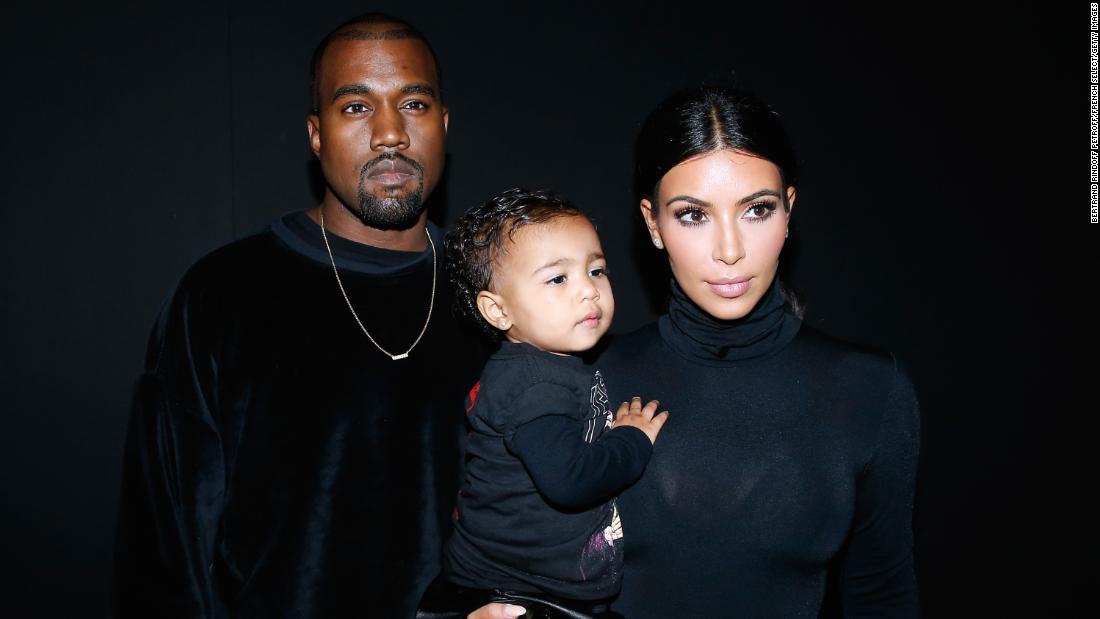 Kim carries the couple&#39;s first child, daughter North, at a fashion show in Paris in September 2014.