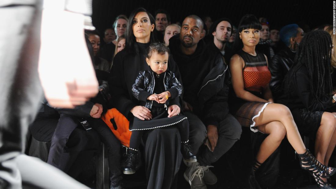 Kim holds North as Kanye and rapper Nicki Minaj attend a fashion show in New York in February 2015.