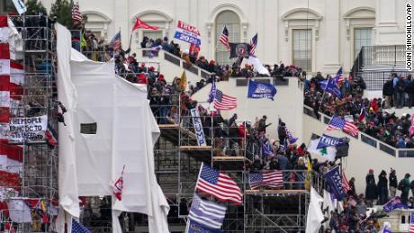 Trump supporters gather outside the Capitol, Wednesday, Jan. 6, 2021, in Washington. (AP Photo/John Minchillo)