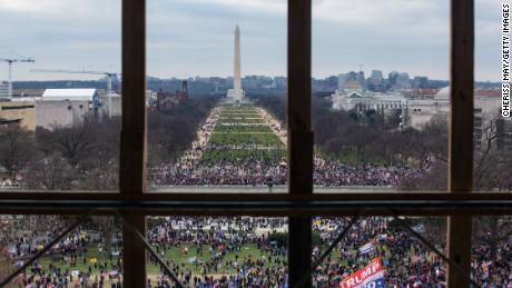 President Donald Trump supporters gather outside, as seen from inside the US Capitol on January 6.
