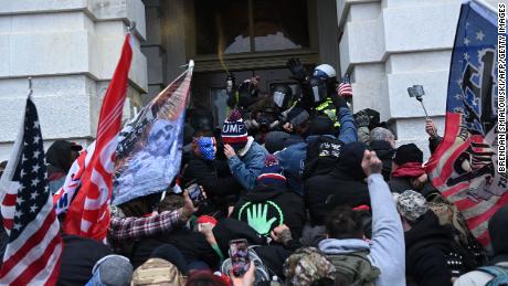 Trump supporters clash with police as they storm the US Capitol on January 6, 2021. 