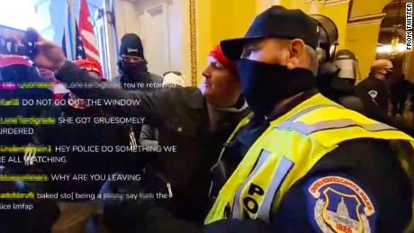 Officer appears to pose for selfie with rioter - CNN Video