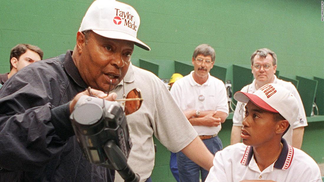 Woods talks with his father, Earl Woods, who features prominently in the HBO documentary &#39;Tiger.&#39;
