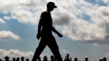 Woods walks off the first tee during the second round of the 2011 Masters Tournament at Augusta National Golf Club on April 8, 2011 in Augusta, Georgia.