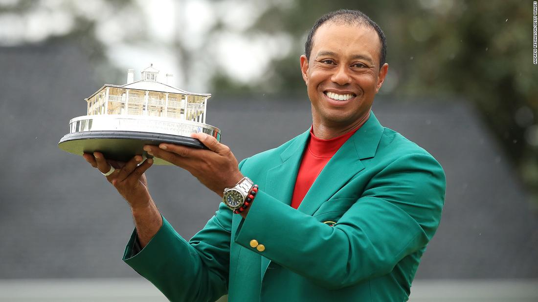 Woods celebrates with the Masters Trophy after winning it for the fifth time. 