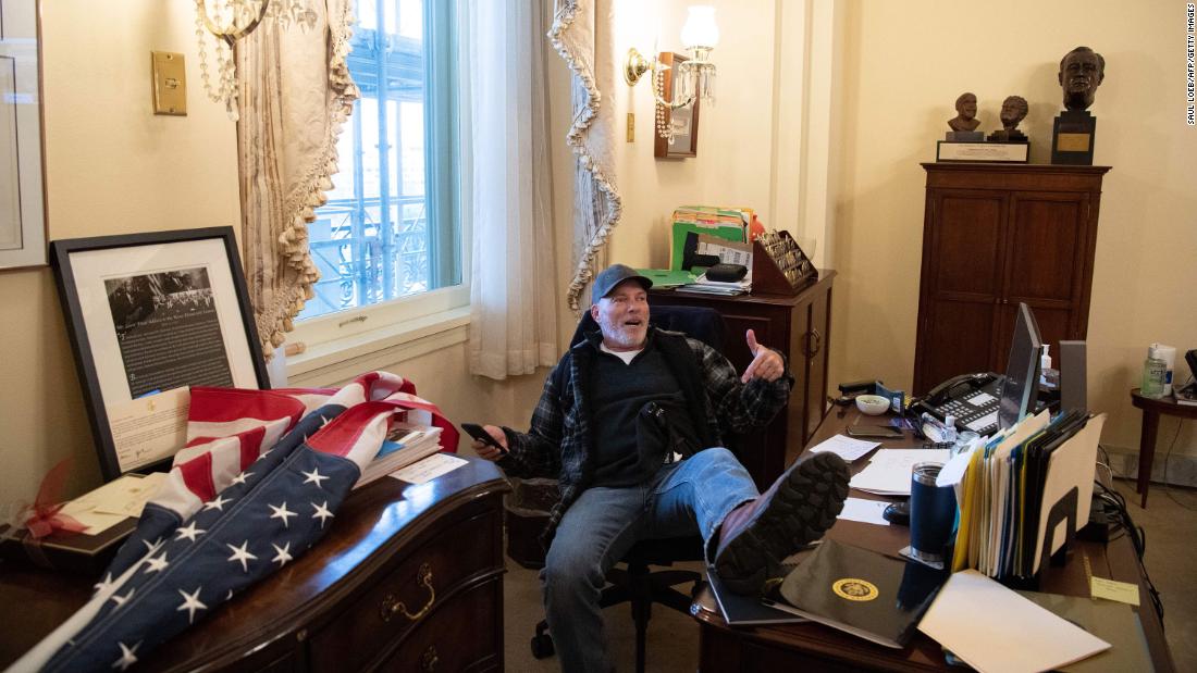 Man seen in viral photograph at Nancy Pelosi’s desk faces charges, officials say