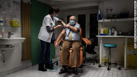 A member of the medical staff at a hospital in Lyon, France receives the Pfizer/BioNTech vaccine on January 6.