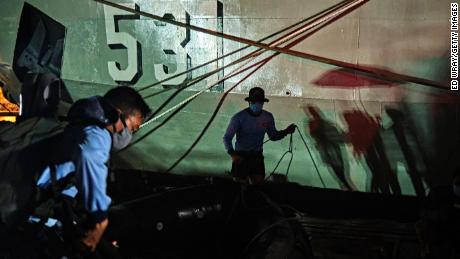 Indonesian Navy divers prepare for a search for Sriwijaya Air Flight 182 on Saturday night. 