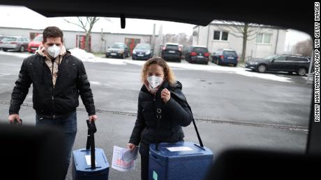 Employees carry boxes with the Pfizer/BioNTech vaccine to a  Covid-19 center near Magdeburg, Germany on January 8.