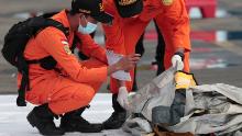 Rescuers inspects debris found in the waters around the location where a Sriwijaya Air passenger jet has lost contact, at the search and rescue command center at Tanjung Priok Port in Jakarta, on January 10, 2021. 