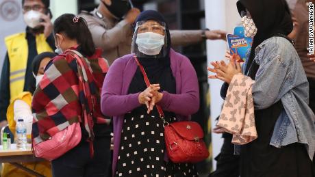 Relatives of passengers arrive at a crisis center set up at Soekarno-Hatta International Airport on Saturday. 