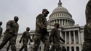 National Guard members march on the U.S. Capitol Building grounds on January 11, 2020 in Washington, DC after a pro-Trump insurrectionist mob breached the security of the nations capitol on Jan 6.