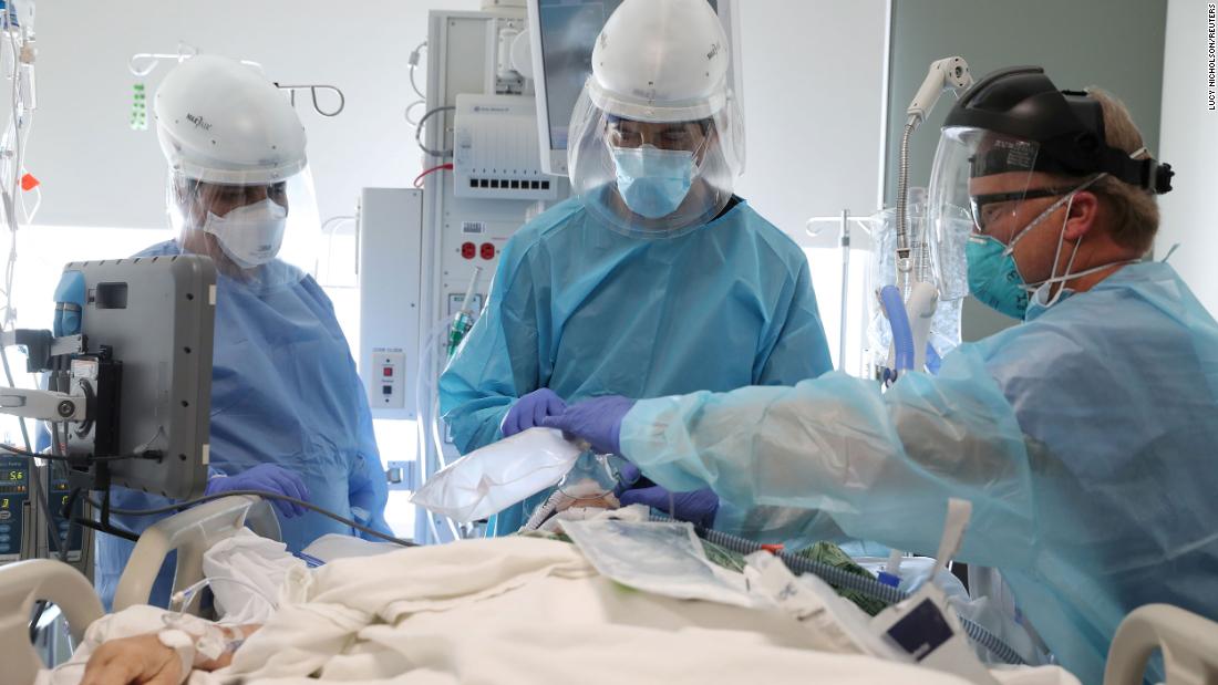 Dr. Dan Ponticiello and Dr. Gabriel Gomez intubate a coronavirus patient at a hospital in Mission Viejo, California, on January 8.