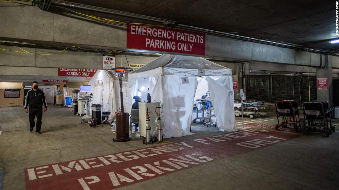 Dr. Thomas Yadegar walks inside a temporary emergency room that was built inside a parking garage at Providence Cedars-Sinai Tarzana Medical Center, a hospital in Tarzana, California.