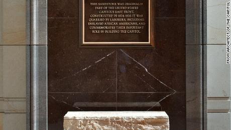 A commemorative marker at the visitor center honors the work of laborers, including enslaved African Americans, in building the US Capitol.