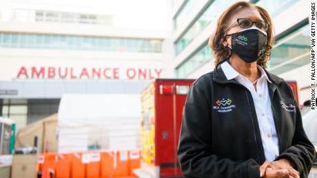 Dr Elaine Batchlor, standing in front of her hospital.