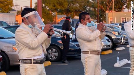 The mariachi band that performed at the funeral in the parking lot.