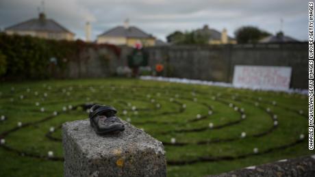 A baby shoe is seen at the Tuam site in Ireland&#39;s County Galway during a 2019 vigil.