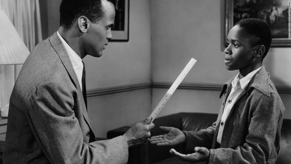 Belafonte, left, plays a school principal in a scene from the film &quot;See How They Run&quot; in 1952. Appearing with Belafonte in the scene is Philip Hepburn.