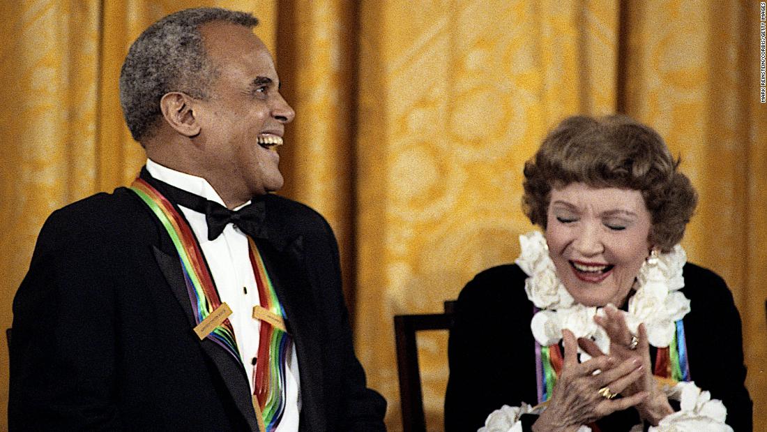 Belafonte and actress Claudette Colbert, two Kennedy Center honorees, laugh at a joke made by first lady Barbara Bush during a reception in Washington, DC, in 1989.