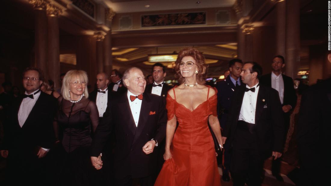 Adelson holds the hand of his wife, Miriam, at the 1999 opening of The Venetian hotel and casino in Las Vegas. Joining them was actress Sophia Loren.