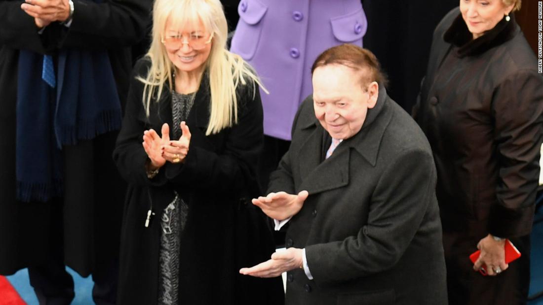 The Adelsons applaud President-elect Donald Trump at Trump&#39;s inauguration in 2017. Sheldon Adelson backed Trump when many traditional GOP donors were reluctant to support the candidate.