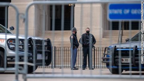 Georgia state troopers stand guard outside the Georgia Capitol in downtown Atlanta on the first day of the 2021 legislative session on Monday, January 11.