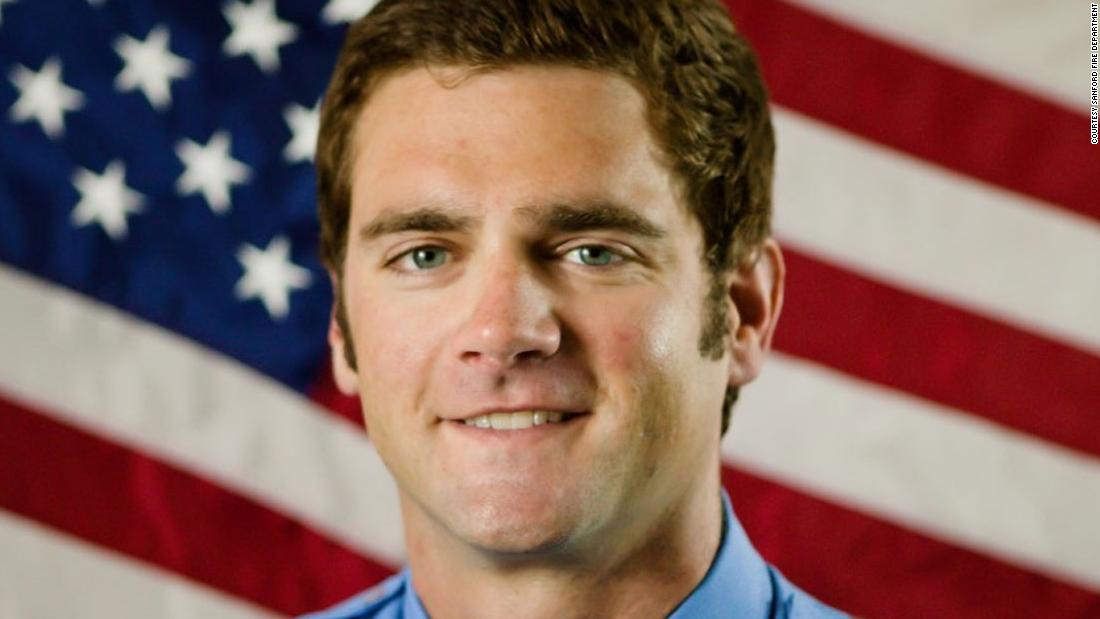 Firefighter Andrew Williams is arrested after the photo shows him pointing to a poster by Mayor Pelosi in the US Capitol building