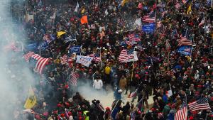 Trump supporters clash with police and security forces as they storm the US Capitol in Washington D.C on January 6, 2021. - Demonstrators breeched security and entered the Capitol as Congress debated the a 2020 presidential election Electoral Vote Certification. (Photo by Roberto Schmidt/AFP/Getty Images)