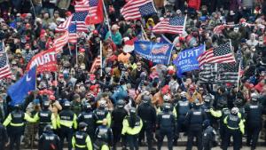 Trump supporters clash with police and security forces as they storm the US Capitol in Washington, DC on January 6, 2021. - Donald Trump&#39;s supporters stormed a session of Congress held today, January 6, to certify Joe Biden&#39;s election win, triggering unprecedented chaos and violence at the heart of American democracy and accusations the president was attempting a coup. (Photo by Olivier DOULIERY / AFP) (Photo by OLIVIER DOULIERY/AFP via Getty Images)