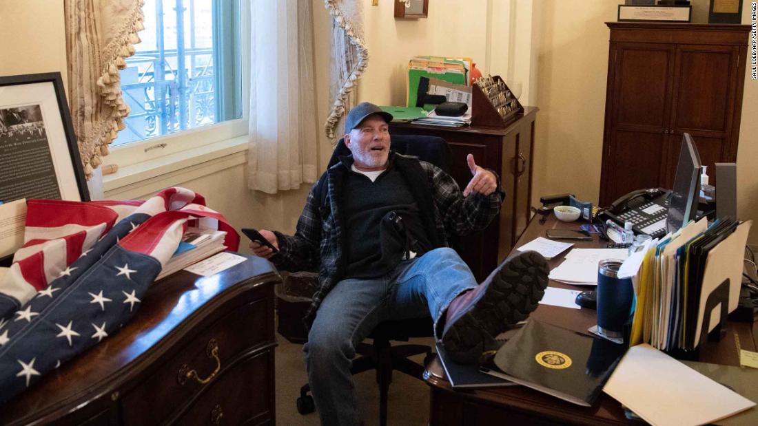 Man who put his feet on desk in Pelosi's office during Capitol riot to be released from jail pending trial