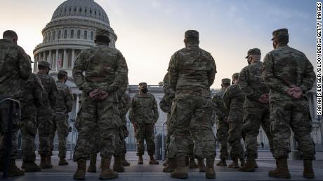 Members of the National Guard assemble outside of the U.S. Capitol in Washington, D.C., U.S., on Thursday, Jan. 14, 2021. President Trump&#39;s unprecedented second impeachment heads to the Senate, where his fate rests with Republican leader McConnell, who now has more leverage than ever over the president in his final week in office. 