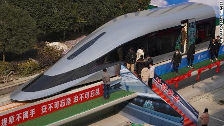 People visit a prototype magnetic levitation train developed with high-temperature superconducting (HTS) maglev technology at the launch ceremony in Chengdu, in southwestern China&#39;s Sichuan province on January 13, 2021. (Photo by STR / AFP) / China OUT (Photo by STR/AFP via Getty Images)