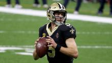 Brees looks to throw a pass against the Chicago Bears during the fourth quarter in the NFC Wild Card Playoff game.