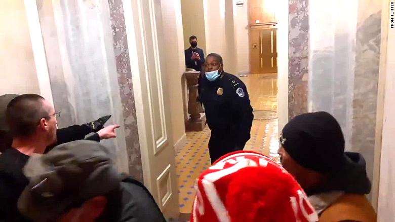 Video shows new angle of cop leading mob away from Senate chambers - CNN  Video